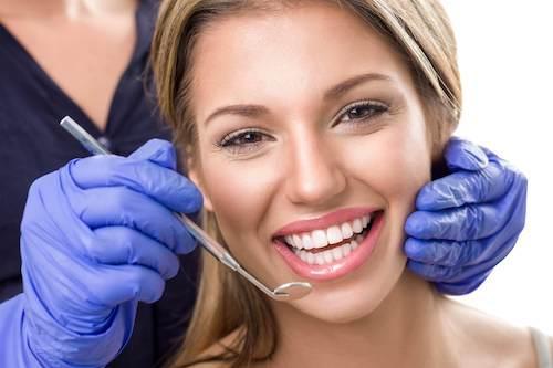 woman smiling with bright smile after cosmetic dentistry