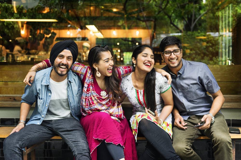 family of four hugging on couch l dentist thornbury