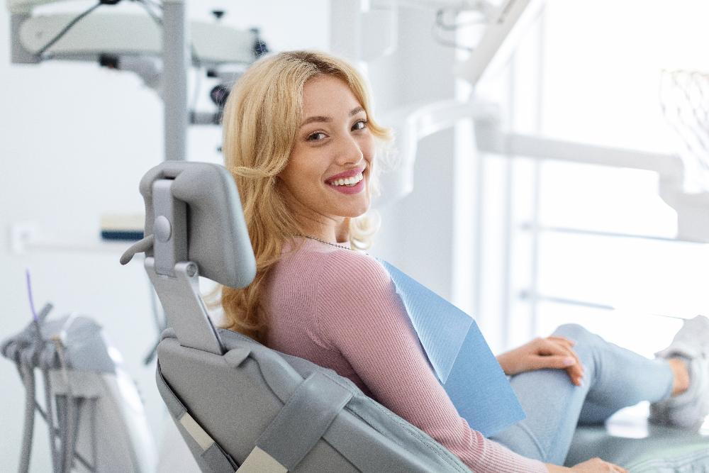 A smiling woman getting a dental exam