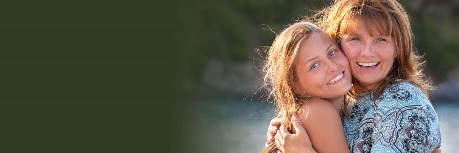 A mother and daughter hugging | family dentist Clifton Hill