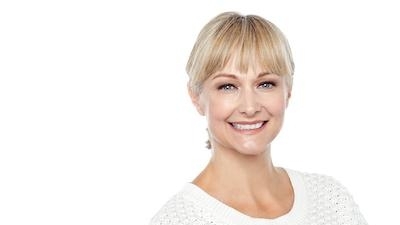 blonde woman with white shirt l cosmetic dentist northcote 