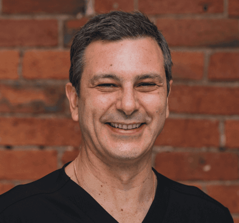 headshot of dr malamas | dentist clifton hill vic