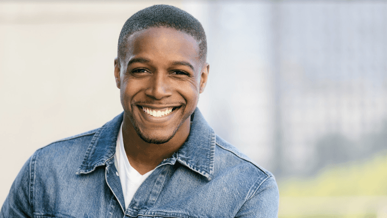 young couple hugging outside l dentist northcote