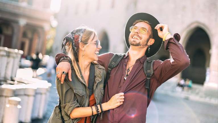 A couple smiling in the city | dentist clifton hill