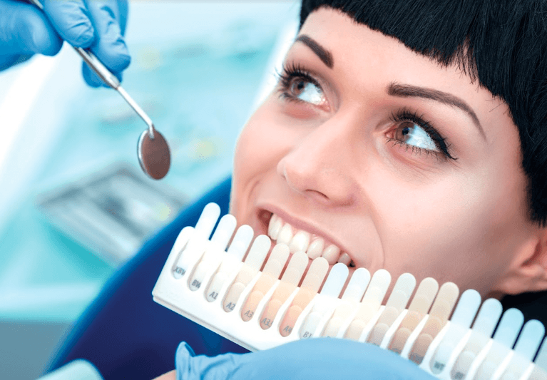 woman picking dental veneer shade | cosmetic dentistry northcote