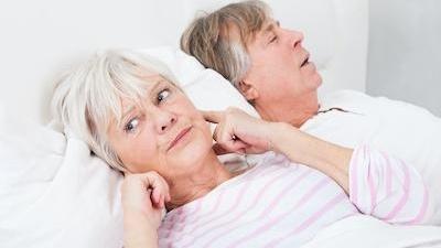 woman covering ears from snoring l dentist northcote