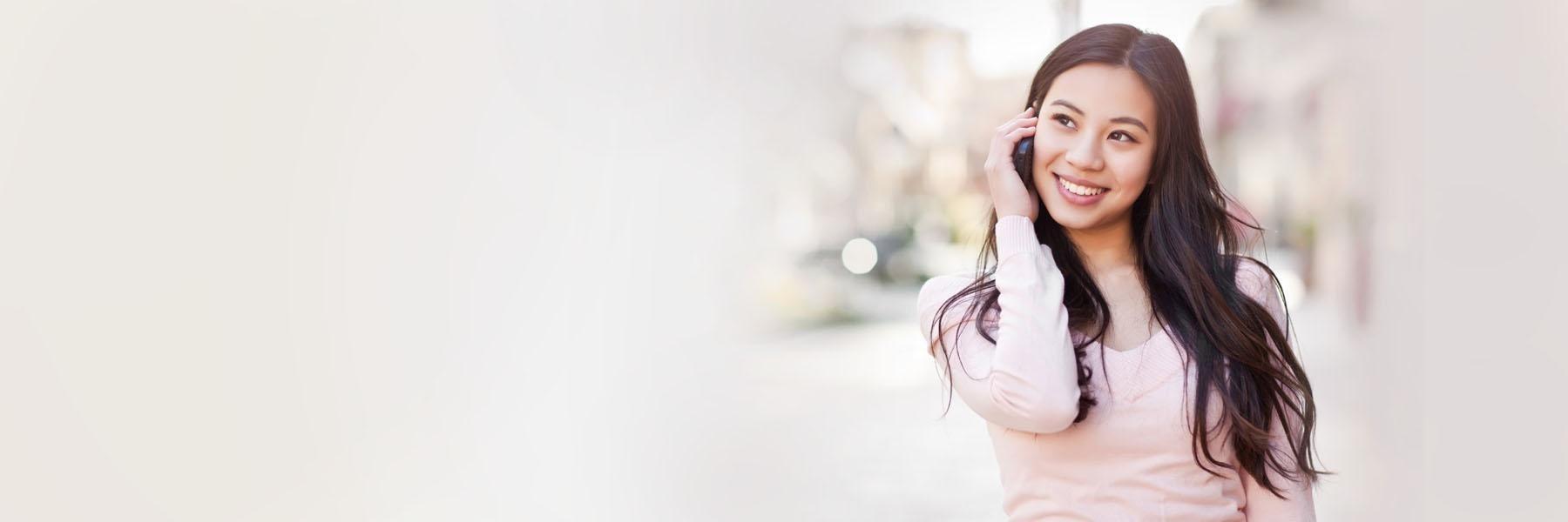 Woman talking on cell phone | Dentist Clifton Hill VIC