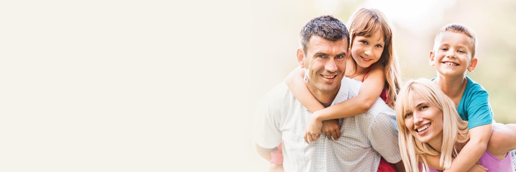 Mother, father, son, and daughter smiling | Dentist Clifton Hill