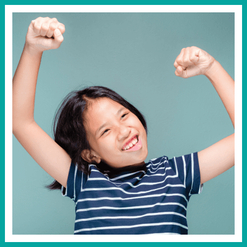 A happy child cheering